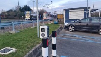 From back to front: a Stagecoach bus, a tram, and an electric car charger.
