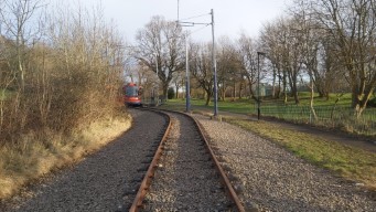The tram peeking round the corner.