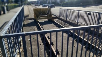 A shot of the buffer stop and overrun rail at Middlewood from the rear. There is a short
            section of rail not buried in Tarmac for overruns.