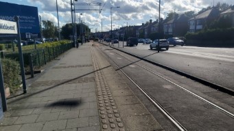A long shot looking down the two platforms at Middlewood tram stop.